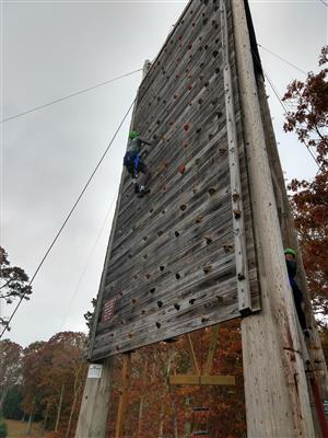 Student on climbing wall in adventure education 