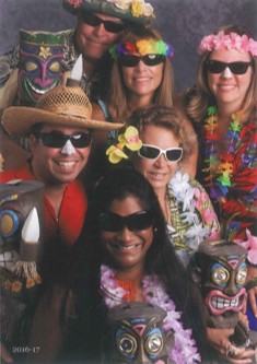 Lifetouch portrait of science department teachers in tropical attire.