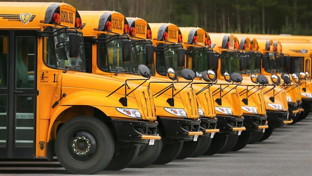 School buses parked and lined up School buses parked and lined up