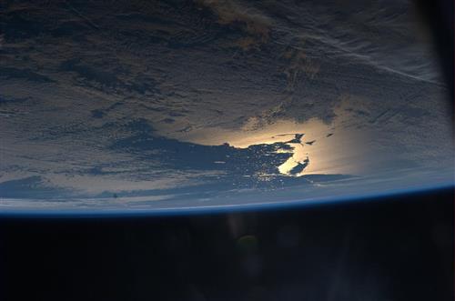 Photo from space of Earth showing bright light on Cape Cod 